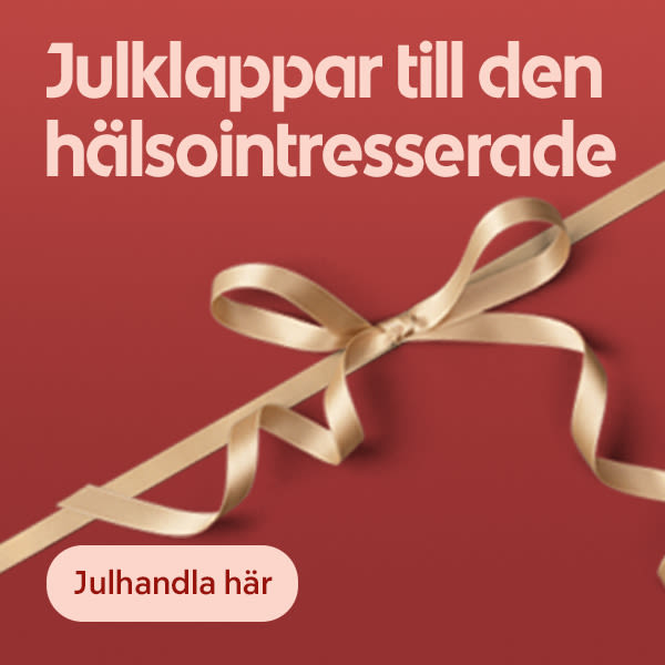 Gyllene sidenband knutet i rosett över röd bakgrund med texten "Julklappar till den hälsointresserade" och en knapp med texten "Julhandla här".