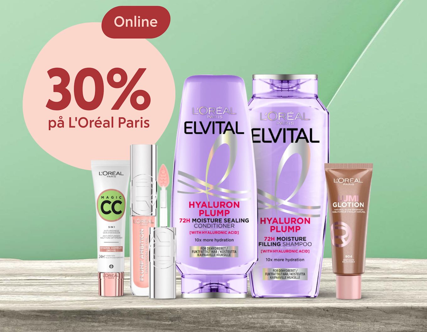 L'Oréal Paris hår- och hudvårdsprodukter står på träbord med texten "Online 30% på L'Oréal Paris" på grön bakgrund.